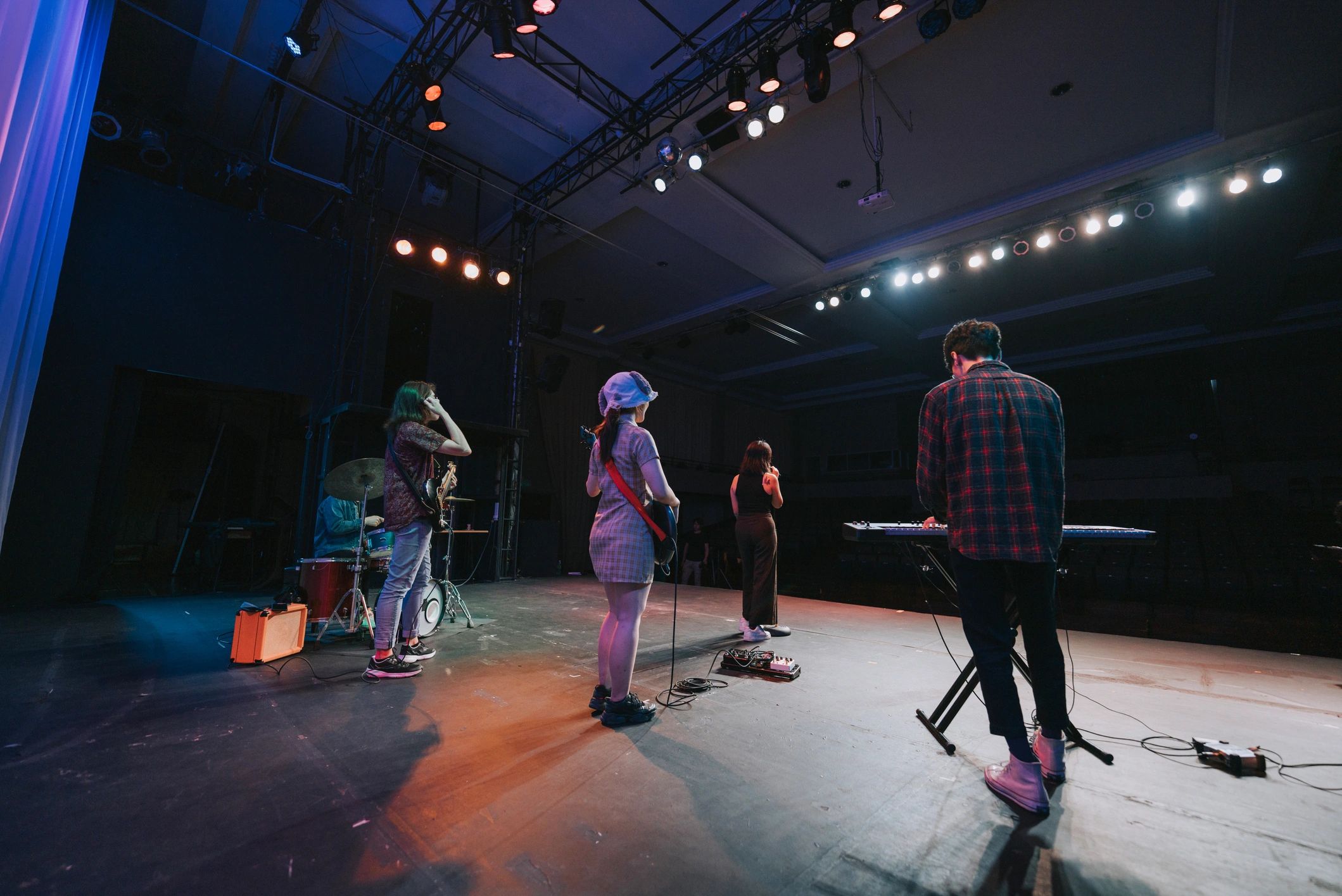 Lead singer and live band performance on stage