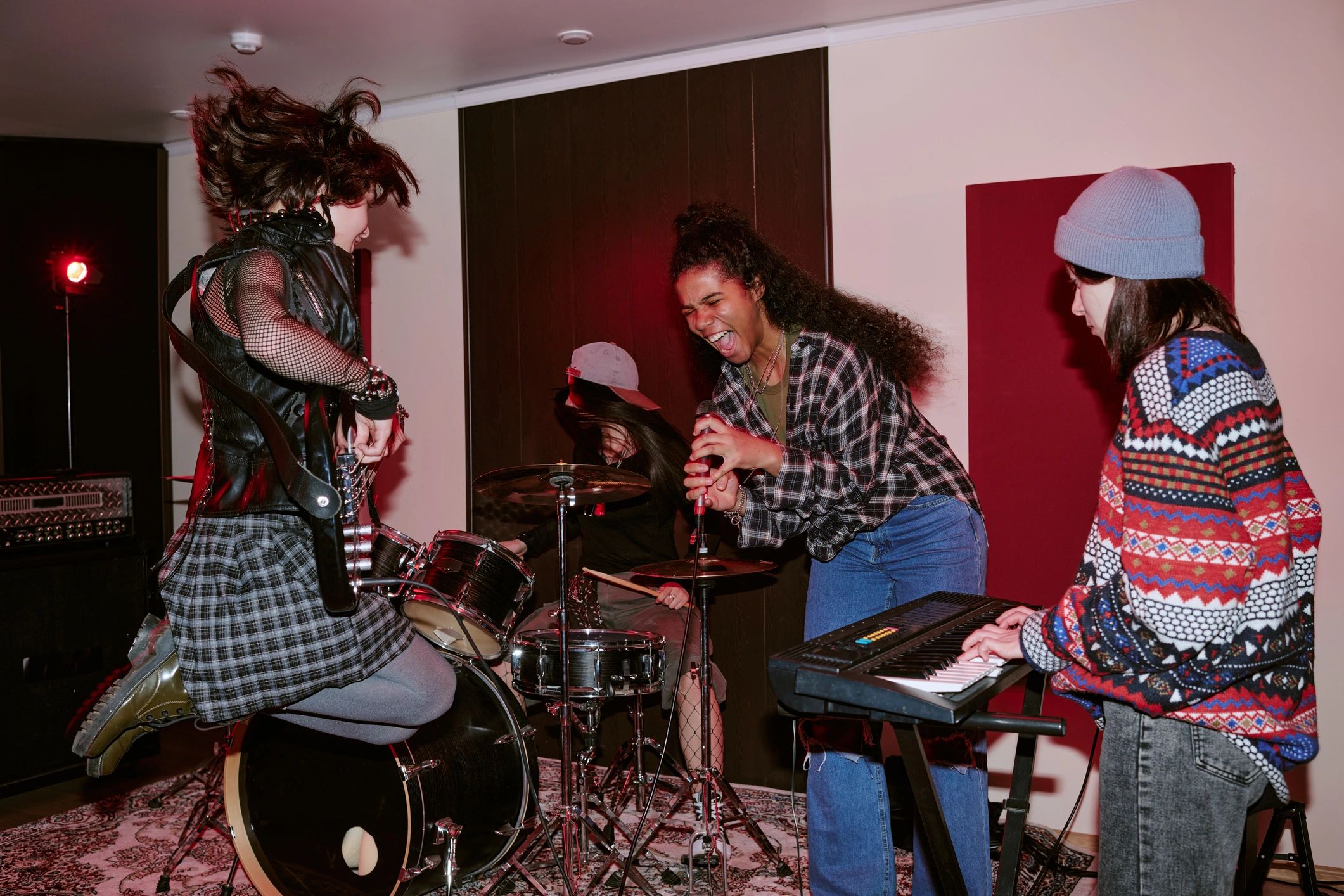 Music group performing live in rehearsal studio